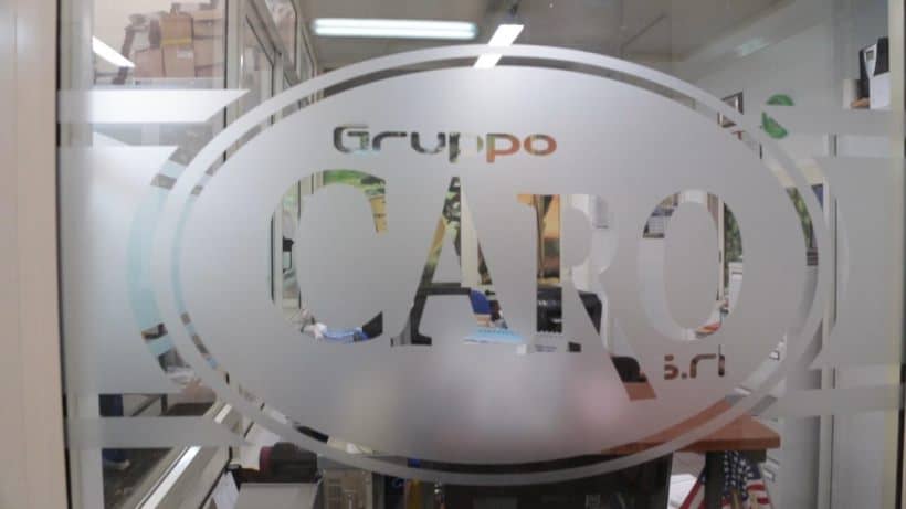 Logo Gruppo Caro branding on glass